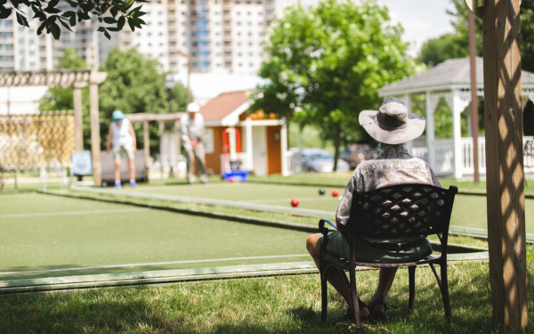 Resident sitting on the 20-acre campus at Luther Village on the Park