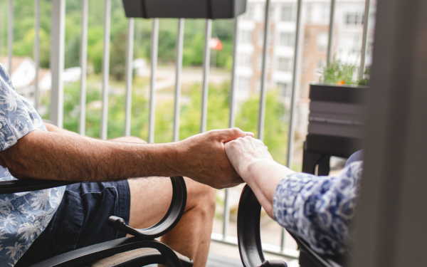 Residents holding hands at Luther Village on the Park