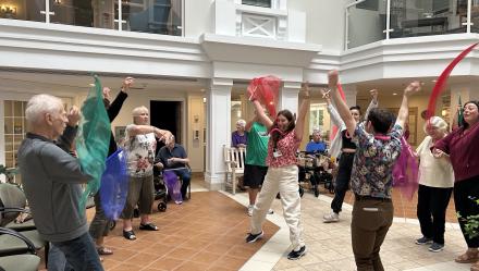 Residents share in a dance at Luther Village on the Park